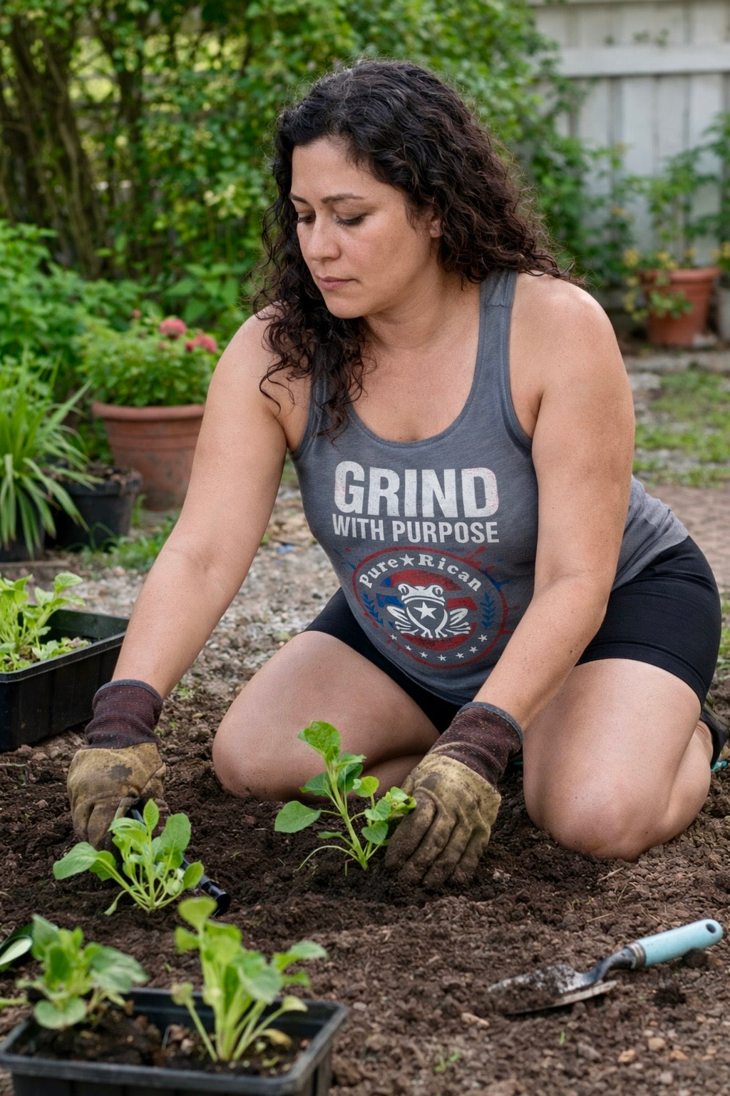 Puro Boricua Grind With Purpose women’s racerback tank front view with statement graphic
