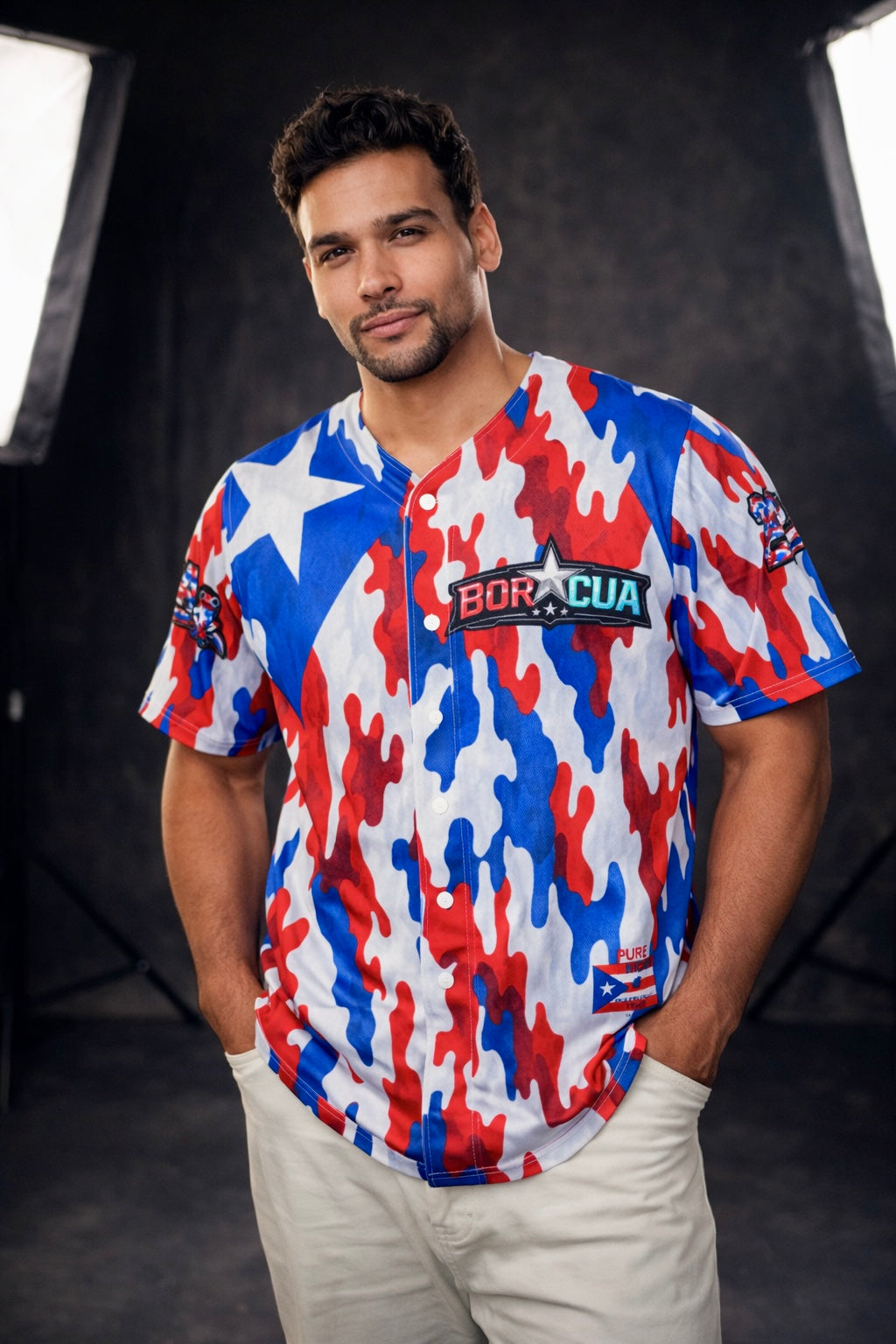 Male model wearing Pure⭐️Rican red white and blue camouflage baseball jersey with BOR⭐️CUA chest logo and Puerto Rican flag-inspired design.
