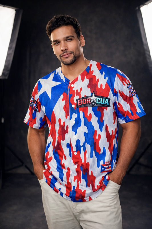 Male model wearing Pure⭐️Rican red white and blue camouflage baseball jersey with BOR⭐️CUA chest logo and Puerto Rican flag-inspired design.