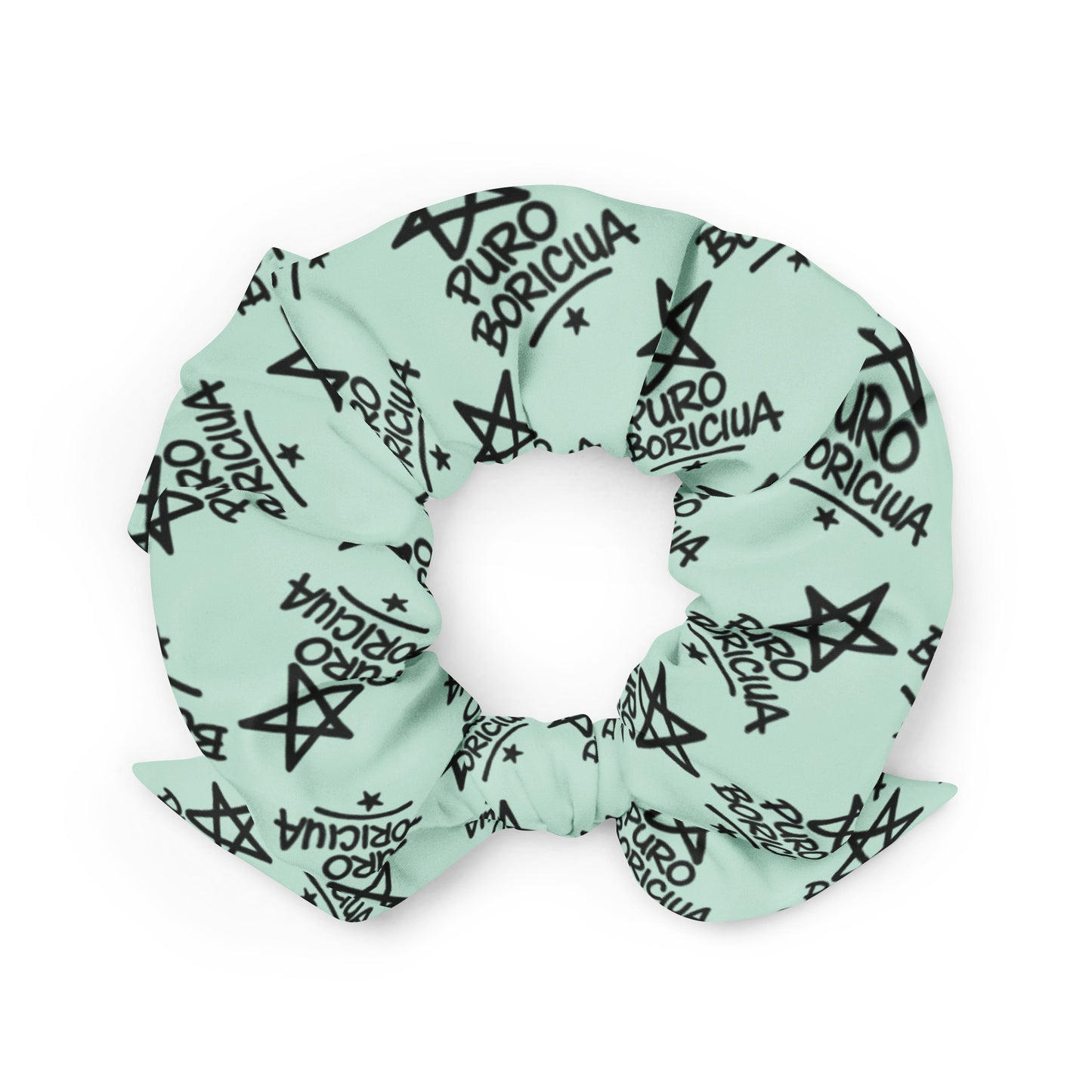 Close-up of Pure⭐️Rican Puro Boricua scrunchie with repeating star logo pattern on soft fabric