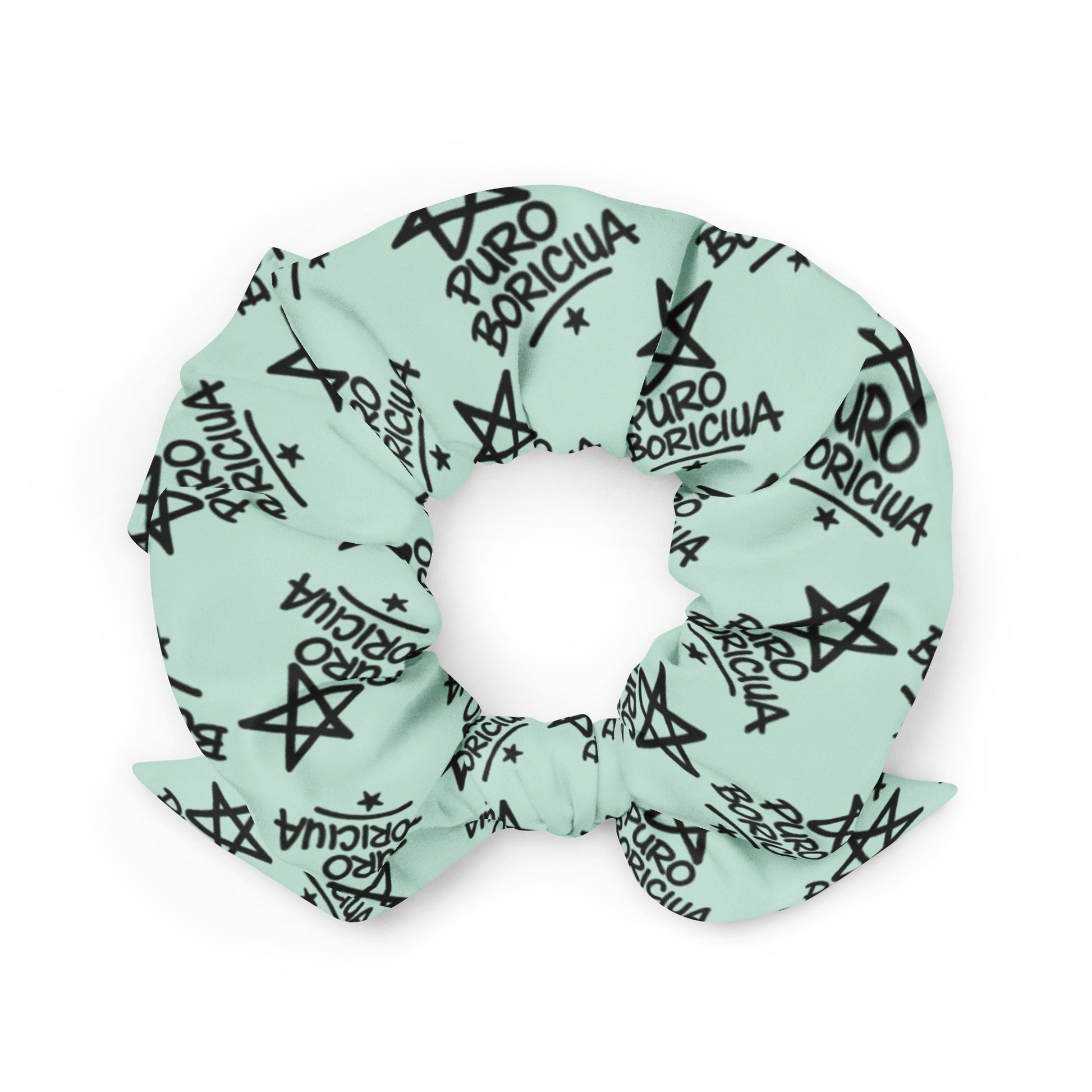 Close-up of Pure⭐️Rican Puro Boricua scrunchie with repeating star logo pattern on soft fabric