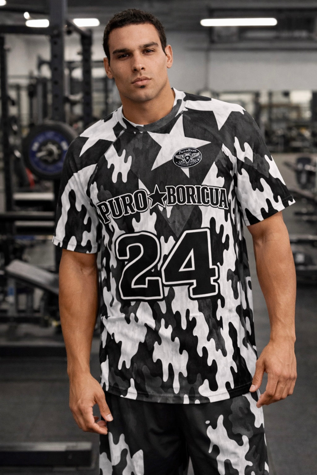 Athletic male model standing in gym wearing Pure⭐️Rican Puro⭐️Boricua 24 compression training shirt.