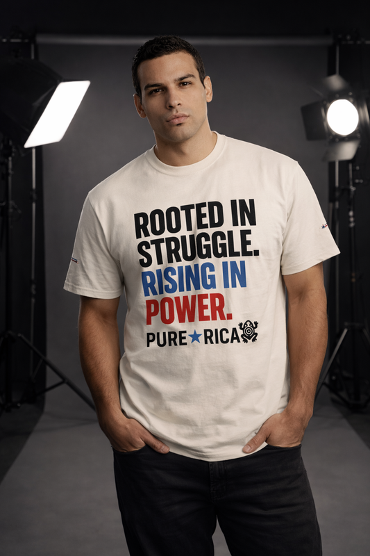 Model wearing the Pure⭐️Rican Rooted in Struggle Rising in Power T-shirt photographed in a professional studio setting