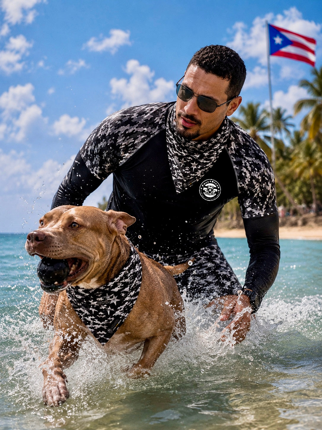 Male model and dog playing in the water wearing matching Pure⭐️Rican Black Camel bandanas at a tropical beach.