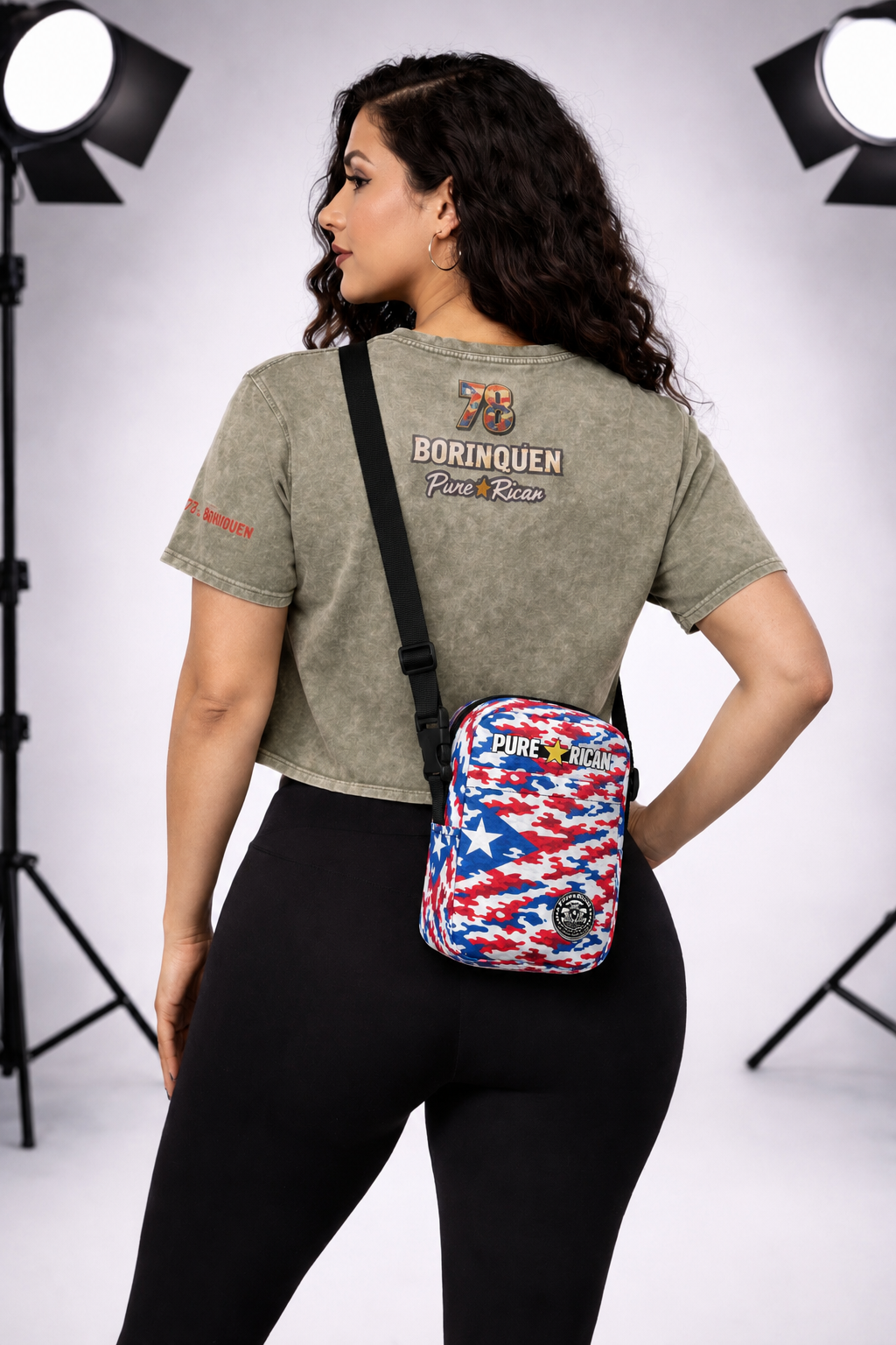 Lifestyle image of a model wearing the Pure⭐️Rican Patriotic Camo Crossbody Bag for everyday use and travel.