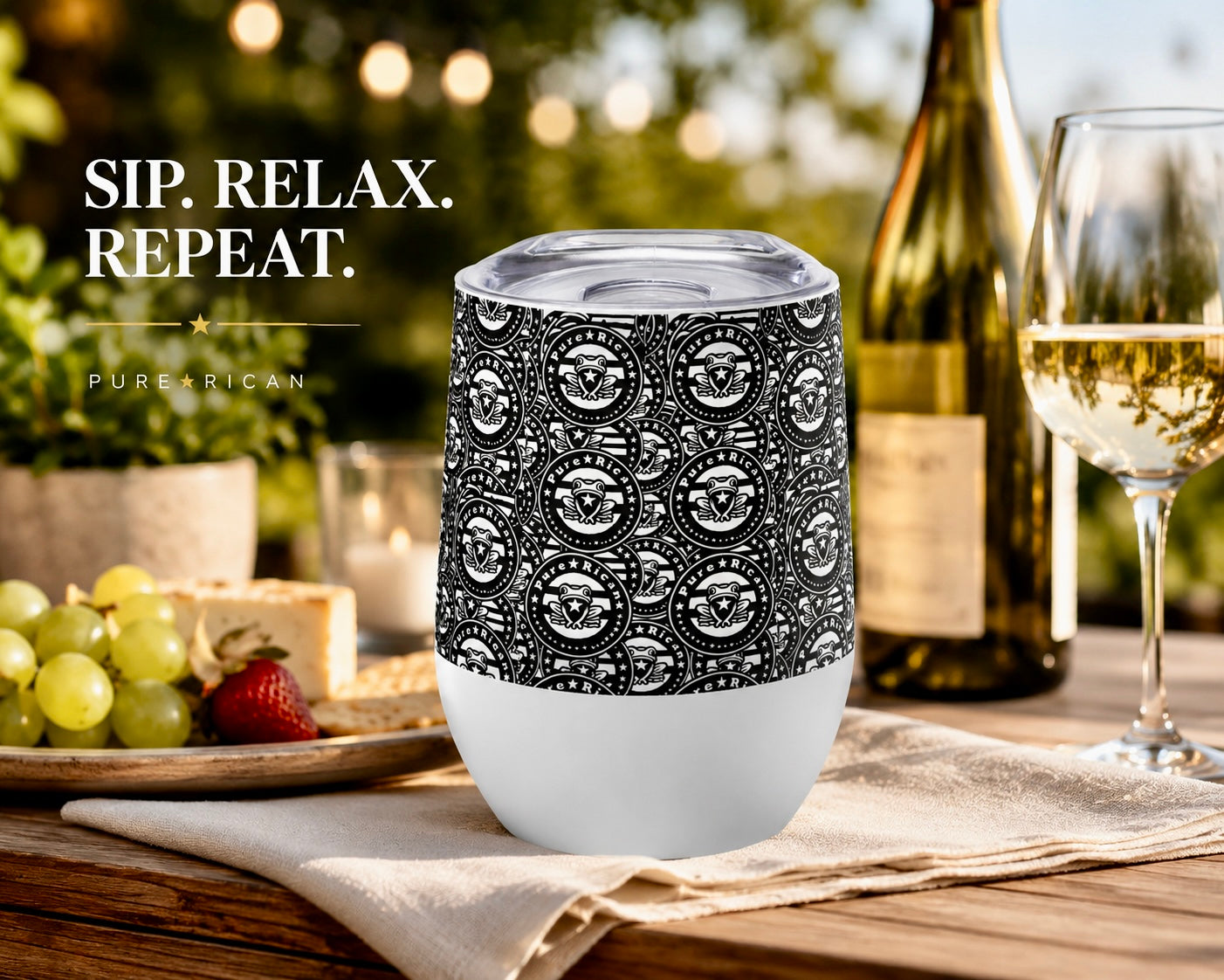 Lifestyle image of the Pure⭐️Rican Heritage Seal stainless steel wine tumbler featuring the signature black-and-white Puerto Rican-inspired pattern with Sapo Concho emblem, insulated 12oz curved design, premium outdoor wine and cocktail drinkware.