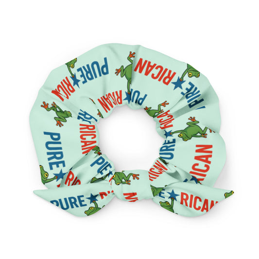 Pure⭐️Rican Sapo Concho scrunchie featuring a repeating logo pattern with the frog mascot hanging from the star in the Pure⭐️Rican name