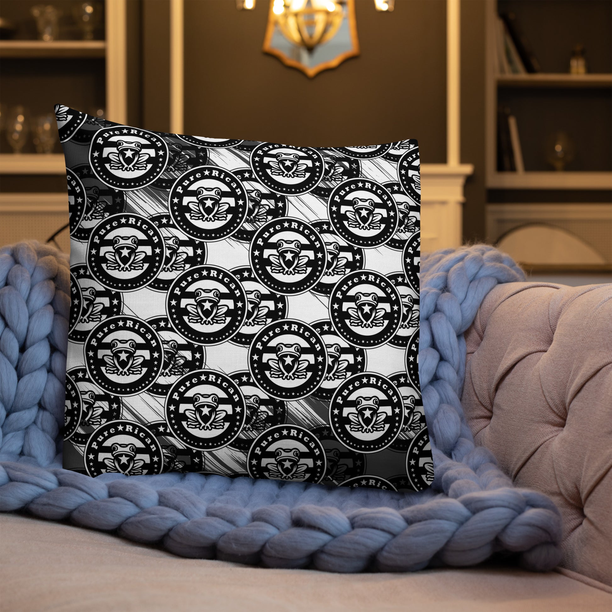 Pure⭐️Rican Sapo Concho black and white throw pillow styled on a modern accent chair in a neutral home setting